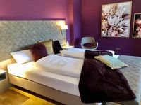 Kingsizebett in der Deluxe Suite 45 m&sup2;